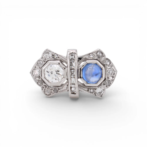 https://cdn.shopify.com/s/files/1/1015/8633/8124/files/art-deco-you-and-me-ring-platinum-diamonds-ceylon-sapphire-cabochon.webp?v=1777896024