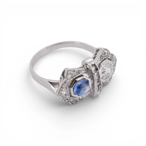 https://cdn.shopify.com/s/files/1/1015/8633/8124/files/art-deco-you-and-me-ring-platinum-diamonds-ceylon-sapphire-cabochon-9.webp?v=1777896024