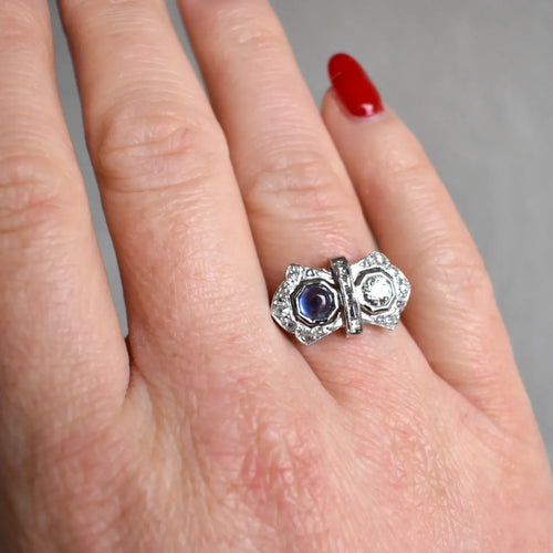 https://cdn.shopify.com/s/files/1/1015/8633/8124/files/art-deco-you-and-me-ring-platinum-diamonds-ceylon-sapphire-cabochon-6.webp?v=1777896024