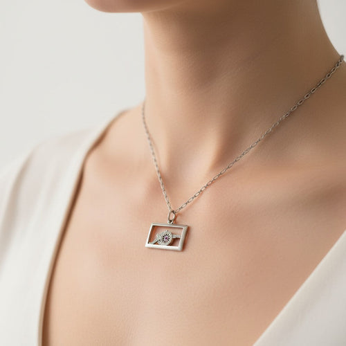 https://cdn.shopify.com/s/files/1/1015/8633/8124/files/art-deco-charm-platinum-diamonds-ruby-2.jpg?v=1779475224