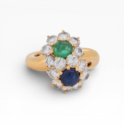 https://cdn.shopify.com/s/files/1/1015/8633/8124/files/you-and-me-ring-emerald-sapphire-diamonds-1.jpg?v=1778755921