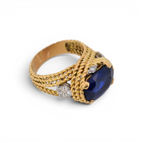 https://cdn.shopify.com/s/files/1/1015/8633/8124/files/vintage-statement-gold-ring-unheated-intense-blue-ceylon-sapphire-diamonds.jpg?v=1779463623