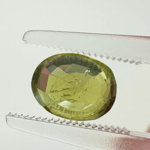 https://cdn.shopify.com/s/files/1/1015/8633/8124/files/unheated-green-sapphire-ceylon-back-view.jpg?v=1779878862