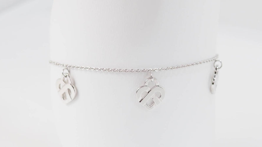 Bracelet Poiray Cœur Entrelacé - Bracelet en or blanc 58 Facettes 32973