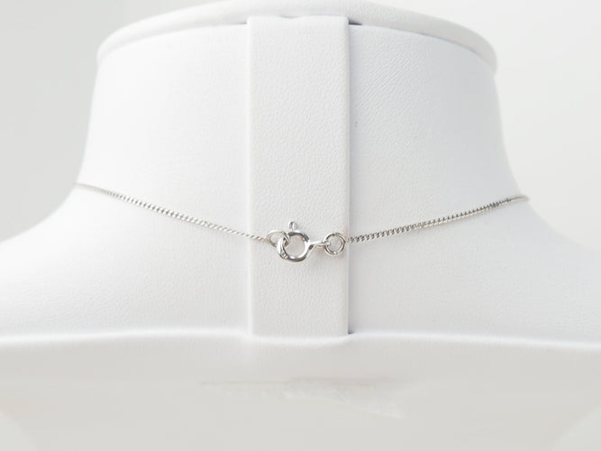 Collier Collier croix en or blanc et diamants 58 Facettes 21080