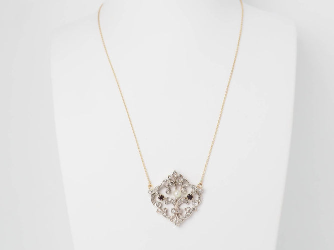 Collier Collier volutes en or jaune, argent, grenats, diamants et perle 58 Facettes 33049