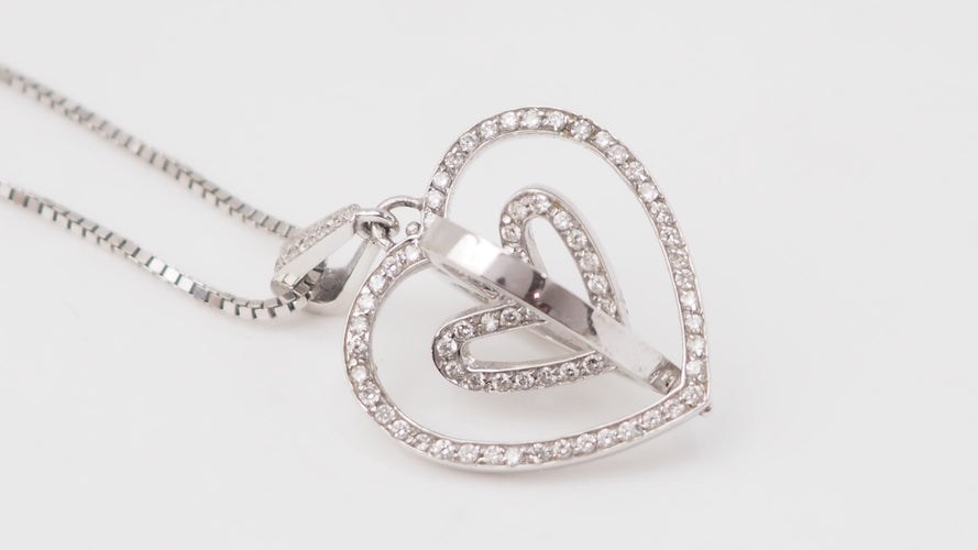 Collier Collier pendentif multi-cœurs en or blanc et diamants 58 Facettes 21089