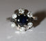 Bague 55 Bague marguerite en or blanc, saphir et diamants 58 Facettes 614