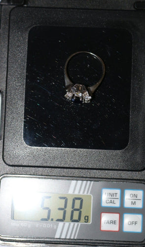 Bague 55 Bague marguerite en or blanc, saphir et diamants 58 Facettes 614
