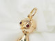 Pendentif Pendentif breloque figurine en or jaune, turquoise et grenats 58 Facettes 33336