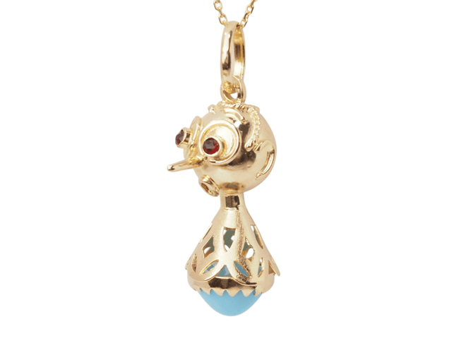 Pendentif Pendentif breloque figurine en or jaune, turquoise et grenats 58 Facettes 33336
