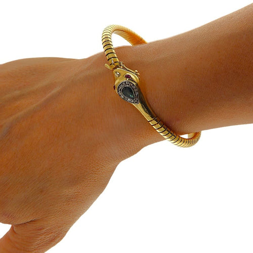 https://www.gioielleriaguidetti.it/wp-content/uploads/2026/06/G3965-bracciale-serpente-oro-giallo-diamanti-rosette-zaffiro-4.jpg