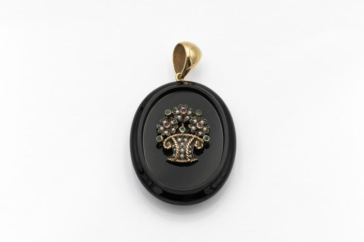 old-secretary-sentimental-medallion-made-of-onyx-with-a-flower-basket-motif-with-rubies-emeralds-and-pearls.jpg