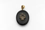 old-secretary-sentimental-medallion-made-of-onyx-with-a-flower-basket-motif-with-rubies-emeralds-and-pearls.jpg