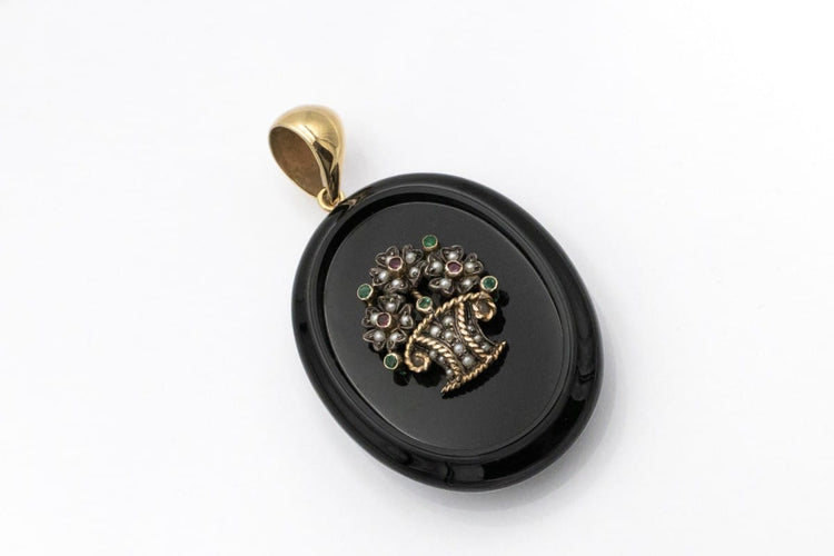 old-secretary-sentimental-medallion-made-of-onyx-with-a-flower-basket-motif-with-rubies-emeralds-and-pearls (2).jpg