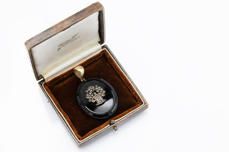 old-secretary-sentimental-medallion-made-of-onyx-with-a-flower-basket-motif-with-rubies-emeralds-and-pearls (1).jpg