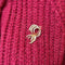 Broche Broche gerbe de plumes en or jaune 58 Facettes REF24069-232