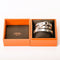 HERMES_Brazalete rígido Débridée en plata_estuche.jpg