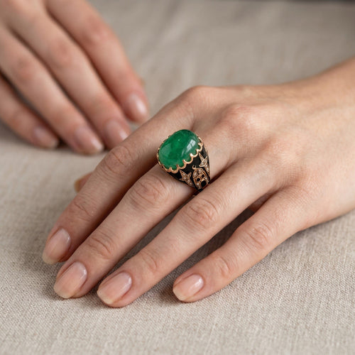 https://cdn.shopify.com/s/files/1/1015/8633/8124/files/antique-ottoman-14k-gold-ural-emerald-cabochon-ring-worn.jpg?v=1782637387