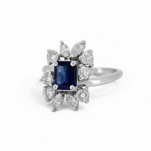 https://cdn.shopify.com/s/files/1/1015/8633/8124/files/vintage-modernist-18k-gold-daisy-sapphire-diamond-ring-sapphire-detail.jpg?v=1782640796