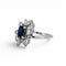 https://cdn.shopify.com/s/files/1/1015/8633/8124/files/vintage-modernist-18k-gold-daisy-sapphire-diamond-ring-left.jpg?v=1782640770