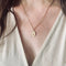 Médaille Augis ovale rubis synthétiques or jaune_portée.jpeg