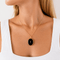 https://cdn.shopify.com/s/files/1/0943/8576/6747/files/medaillon-porte-souvenir-ancien-onyx.png?v=1783008605