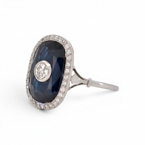 https://cdn.shopify.com/s/files/1/1015/8633/8124/files/antique-art-deco-platinum-sapphire-cocktail-diamond-halo-ring-stone-detail.jpg?v=1783330126