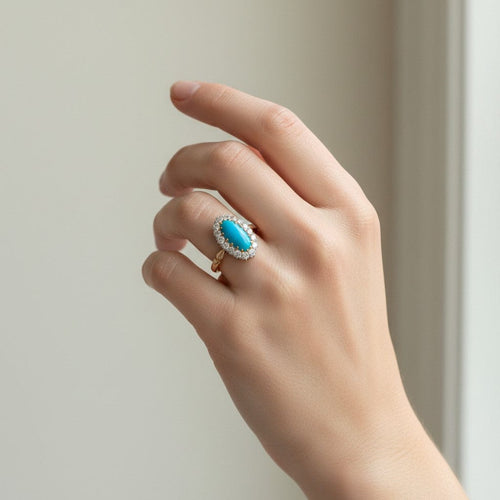 https://cdn.shopify.com/s/files/1/1015/8633/8124/files/antique-victorian-18k-gold-turquoise-diamond-halo-ring-worn.jpg?v=1783331309
