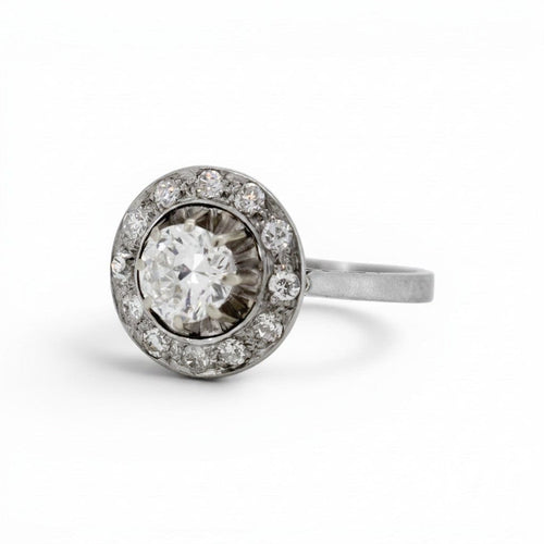 https://cdn.shopify.com/s/files/1/1015/8633/8124/files/antique-art-deco-white-gold-platinum-diamond-halo-ring-left_e054917c-d28e-4046-8034-7ffd2f2a620b.jpg?v=1783338589