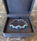 https://cdn.shopify.com/s/files/1/0647/1470/3075/files/BraceletVintage-BraceletZirconsBleusDiamantsPlatineOrGris-JoaillerieParis-LesPierresdeJulie_4.jpg?v=1783424473
