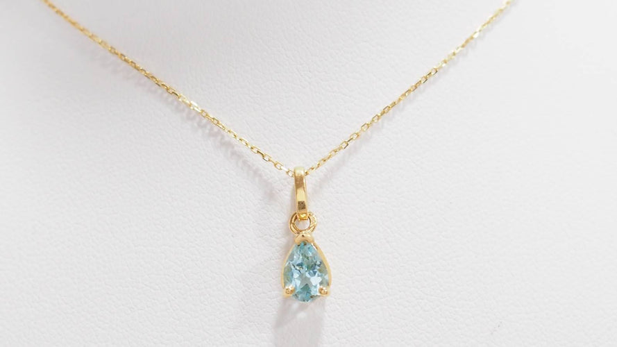 Collier Collier solitaire en or jaune et topaze bleue 58 Facettes XLAA0052