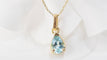 Collier Collier solitaire en or jaune et topaze bleue 58 Facettes XLAA0052