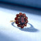 bague-grenat-Marguerit-or-jaune-18k-femme.jpg