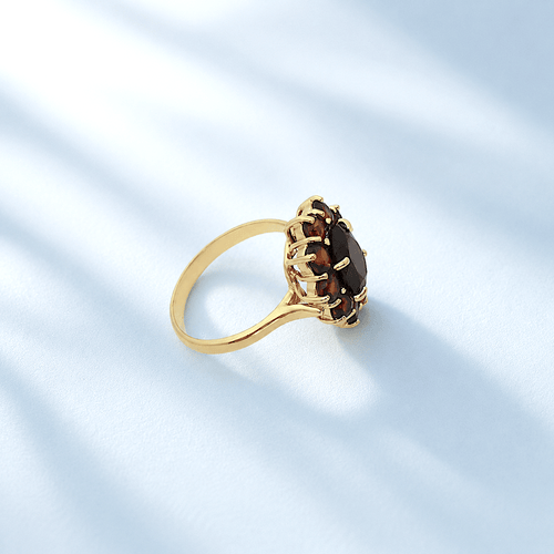 bague-seconde-main-Marguerit-grenat-or-jaune.png
