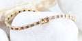 Bracelet vintage en or jaune 18K, rubis et diamants 58 Facettes SC1
