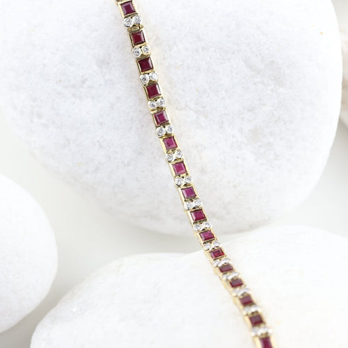 Bracelet vintage en or jaune 18K, rubis et diamants 58 Facettes SC1