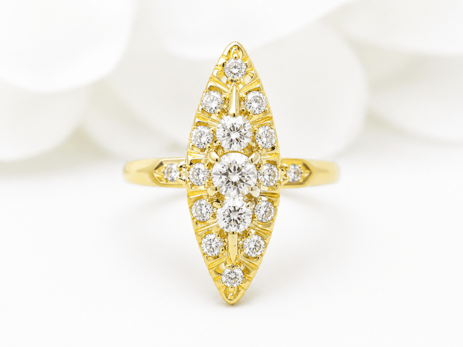 https://cdn.shopify.com/s/files/1/0750/3799/9372/files/Bague_marquise_en_or_jaune_et_diamants.png?v=1784122227