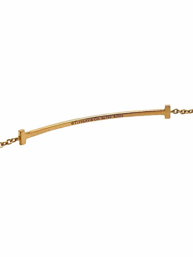 Bracelet Tiffany & Co T - Bracelet en or jaune 18K et diamants 58 Facettes 2134