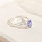 https://cdn.shopify.com/s/files/1/0442/6560/3235/files/entourage-ring-aus-18k-weissgold-mit-tansanit-diamanten-konigliches-blau-brillant-gerahmthoney-jewelry-5064425.jpg?v=1772565439