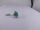 Bague 54 Bague colombienne en or blanc, émeraude et diamants 58 Facettes BA 457