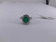 Bague 51.5 Bague halo en or blanc avec émeraude ovale et diamants 58 Facettes BA 500
