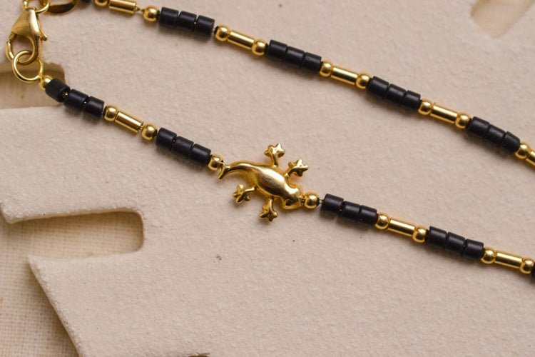 https://cdn.shopify.com/s/files/1/0963/7950/2920/files/Bracelet-lezard-et-perles-de-rocailles-bracelet-Vintage_3e145259-6ca1-4433-bf68-f42b7b95d249.jpg?v=1779981144