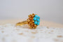 https://cdn.shopify.com/s/files/1/0963/7950/2920/files/bague-fleur-truquoises_0cdc6249-f6e4-45e1-b722-66dc19487f80.jpg?v=1779981926