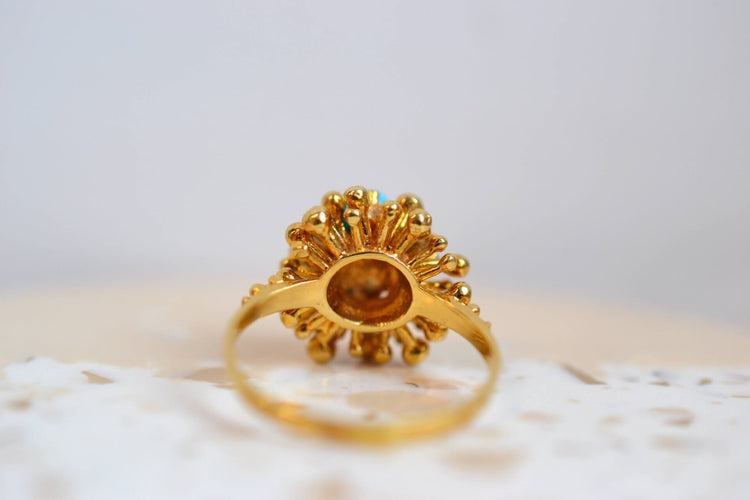 https://cdn.shopify.com/s/files/1/0963/7950/2920/files/bague-forme-fleur-turquoise_6ad48ec2-39b0-40d5-b8f0-9925c21c9daf.jpg?v=1779981926