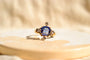 https://cdn.shopify.com/s/files/1/0963/7950/2920/files/Bague-ancienne-en-Or-jaune-18-carats-centree-d_un-Saphir-de-synthese-entoure-de-Diamants_c6b33d6e-aab3-4f11-846c-7144fec43ce3.jpg?v=1779376185
