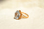 https://cdn.shopify.com/s/files/1/0963/7950/2920/files/bague-cocktail-pierre-bleue_34292990-dc13-45a7-8494-bea21a234957.jpg?v=1779983217