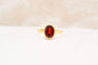 https://cdn.shopify.com/s/files/1/0963/7950/2920/files/bague-or-jaune-grenat.jpg?v=1782305991