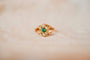https://cdn.shopify.com/s/files/1/0963/7950/2920/files/Bague-Art-Nouveau-pierre-verte-et-perles_ac1af78c-8fff-4b11-846a-310c63d329c2.jpg?v=1779381799