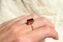 https://cdn.shopify.com/s/files/1/0963/7950/2920/files/bague-ancienne-grenat-taille-emeraude.webp?v=1783347517